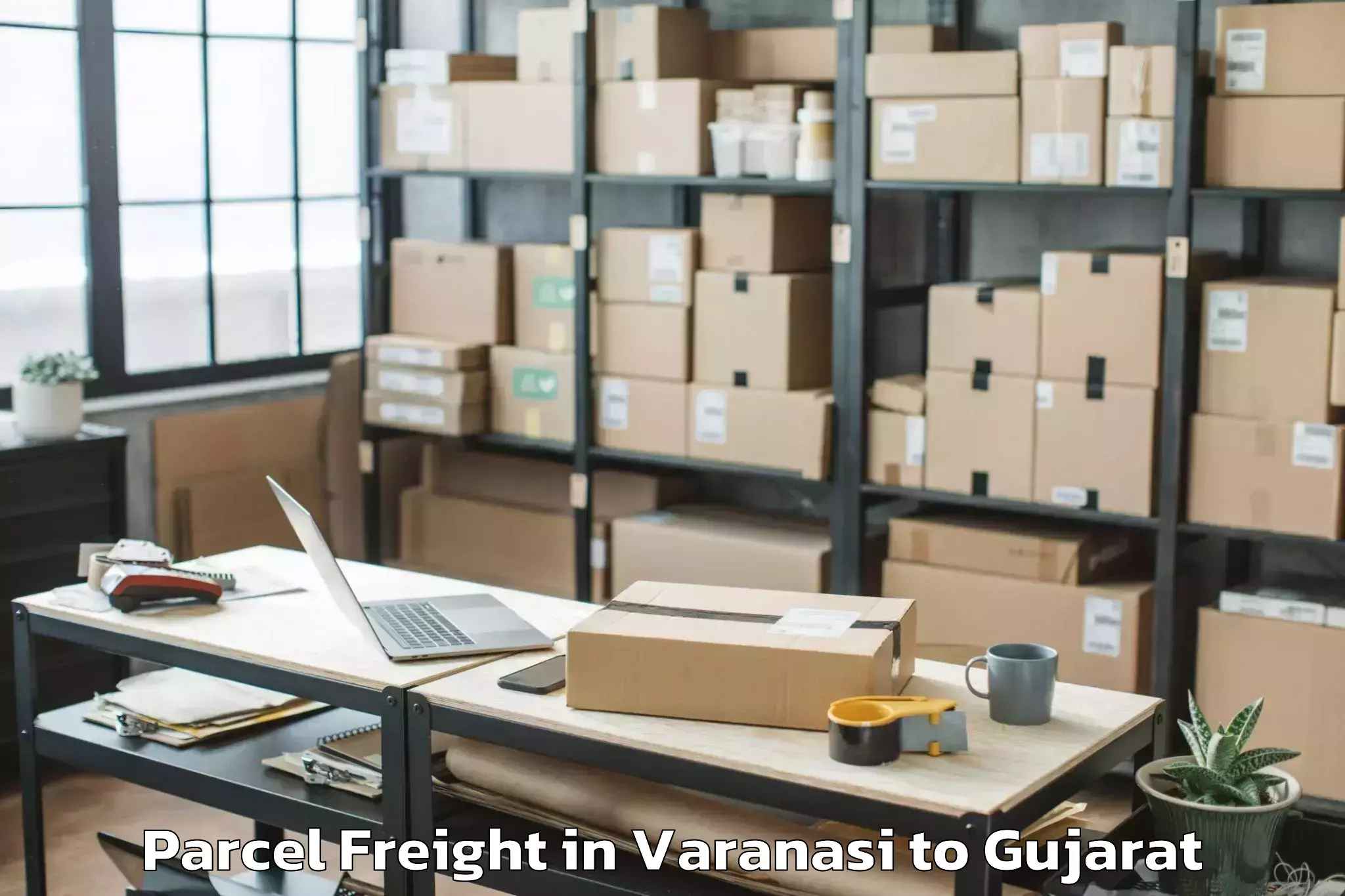 Varanasi to P P Savani University Kosamba Parcel Freight Booking